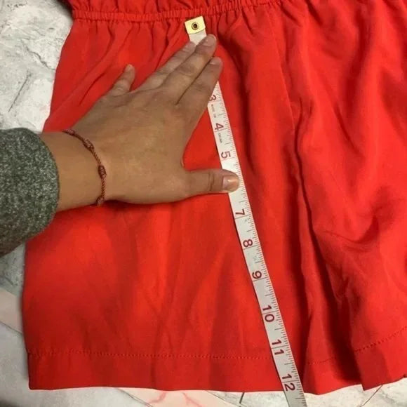 NWT Forever 21 Coral Red Sleeveless Button Front Romper. Size Medium.