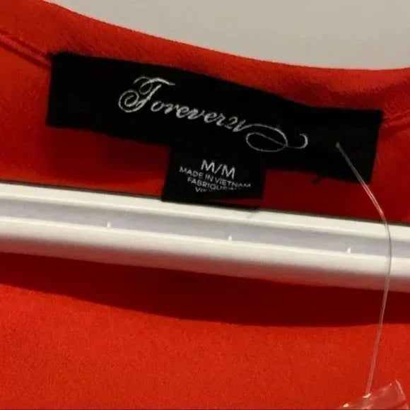 NWT Forever 21 Coral Red Sleeveless Button Front Romper. Size Medium.