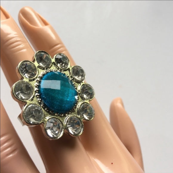 Brand-new big chunky adjustable statement ring 💍 fashion jewelry. 💎 This has a blue round gem stone design in the middle with rhinestones around it. - Findsbyjune.com